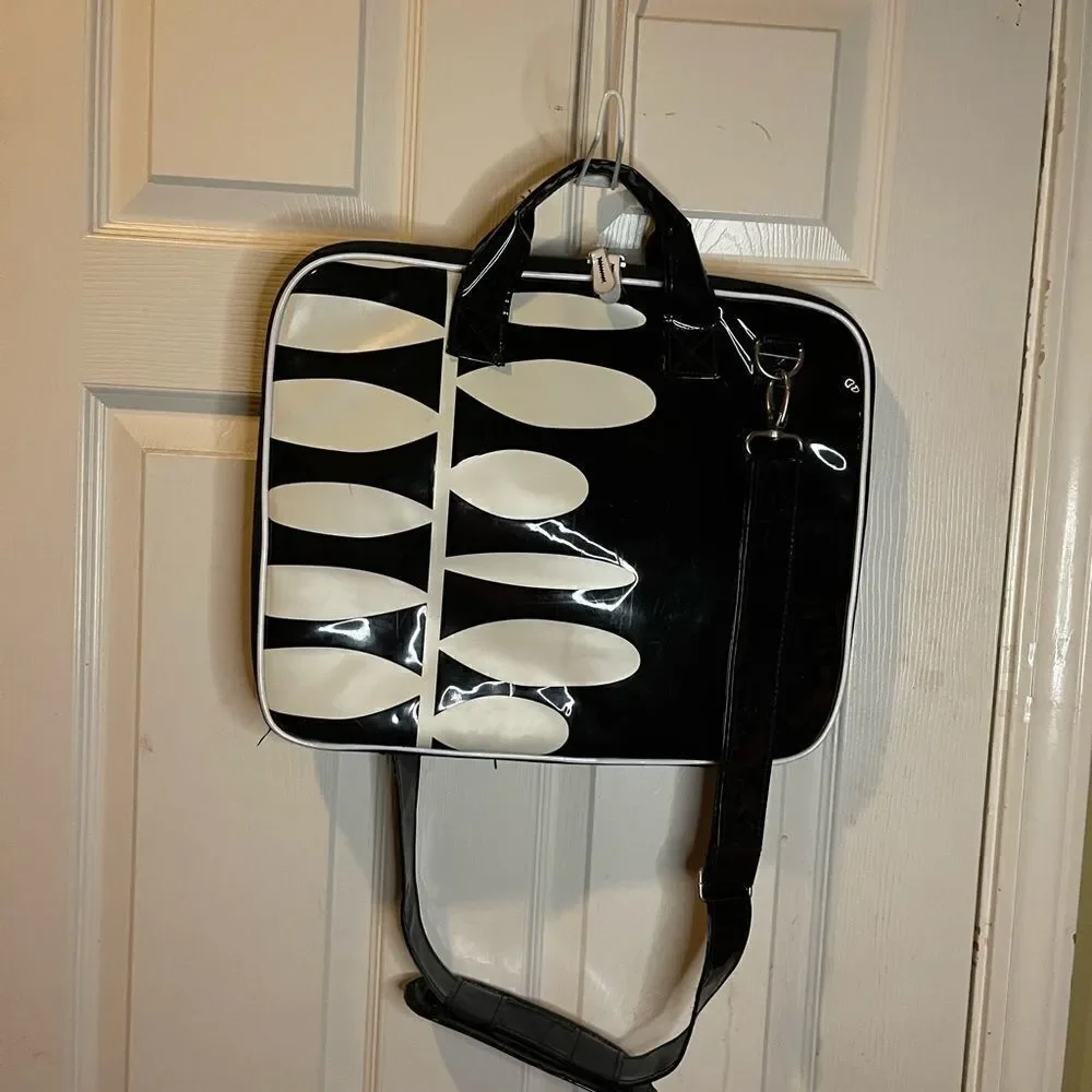 Black and white padded laptop bag with detachable padded shoulder strap